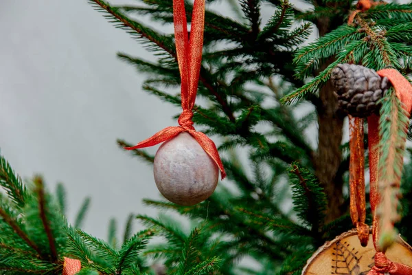 Medieval bauble toy on green pine branch — Stock Photo, Image