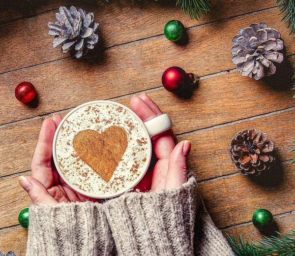 Woman hands holding Christmas cup of coffee — Stock Photo, Image