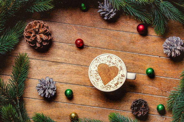 Christmas cup of coffee with heart shape and candy — Stock Photo, Image