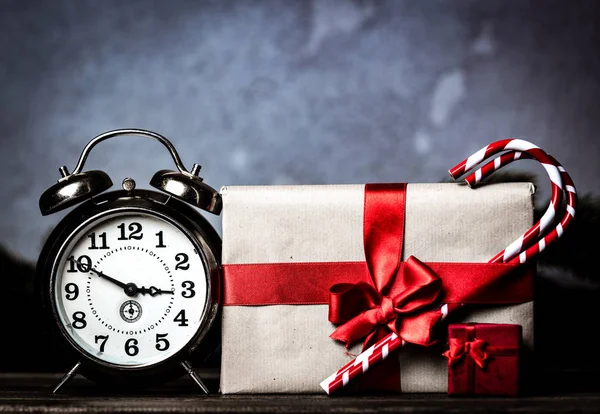 Christmas Gift Bowknot Retro Alarm Clock Lollipop Grey Background — Stock Photo, Image