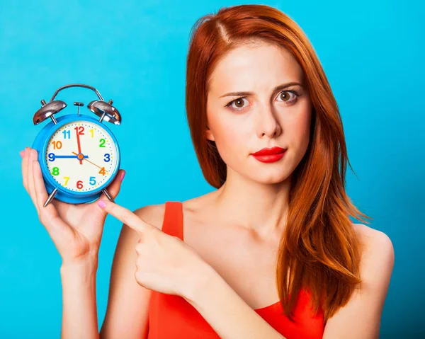 Surprised Redhead Woman Woth Alarm Clock Blue Background — Stock Photo, Image