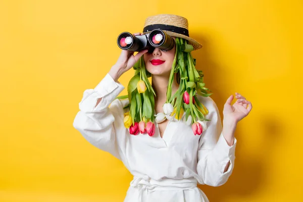 Woman with springtime tulips instead hair and bonocular — Stock Photo, Image