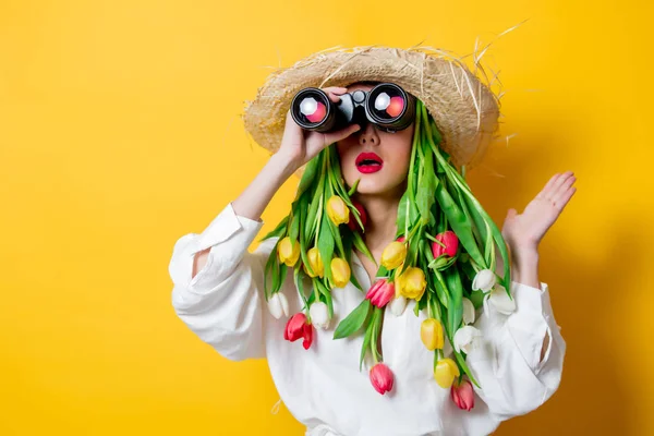 Woman with springtime tulips instead hair and bonocular — Stock Photo, Image
