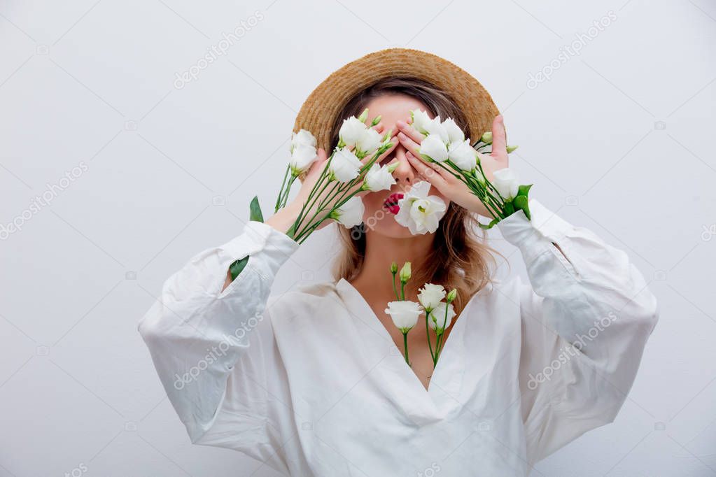 Beautiful woman with white roses in sleeves