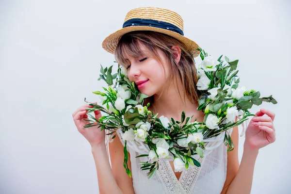 Beautiful woman with white roses wreath on white background — Stock Photo, Image