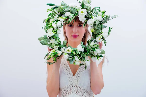 Beautiful woman with white roses wreath on white background — Stock Photo, Image