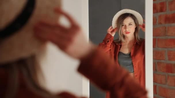 Happy yound woman dressing up near mirror — Stock Video