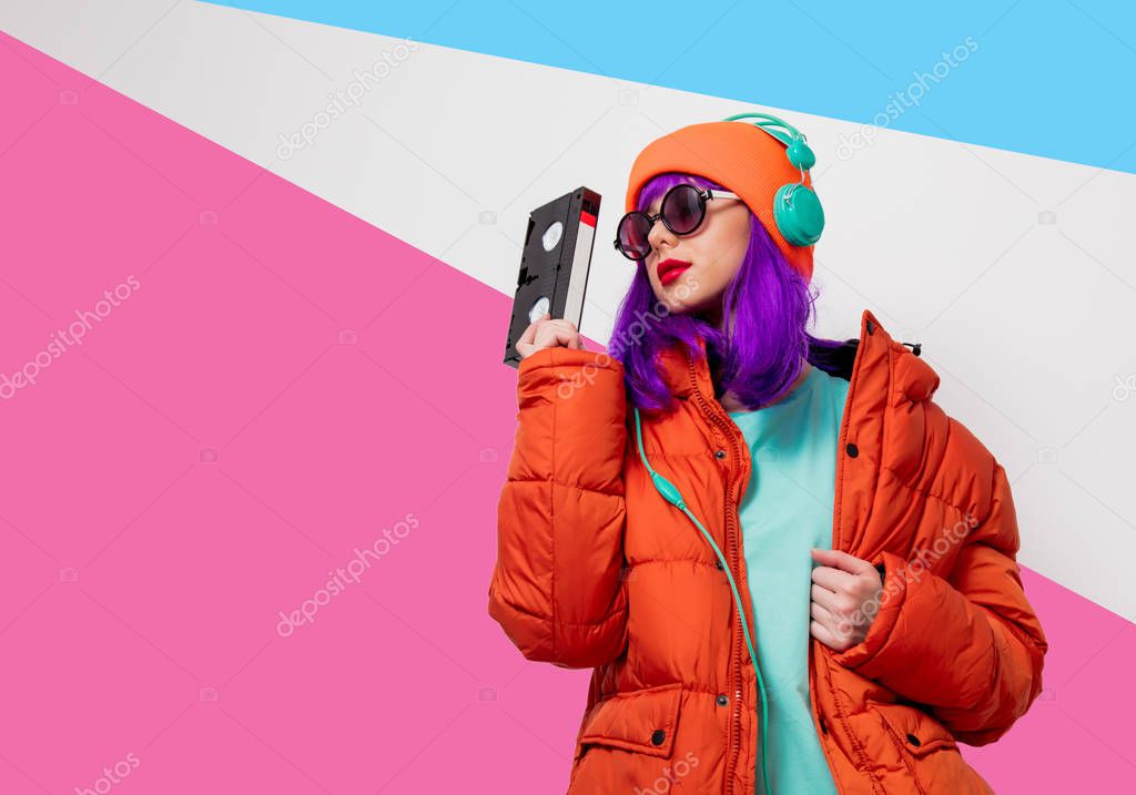girl with purple hair with headphones and VHS