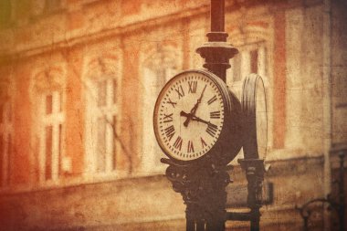 Street clock on a pole. Made in vintage style. clipart