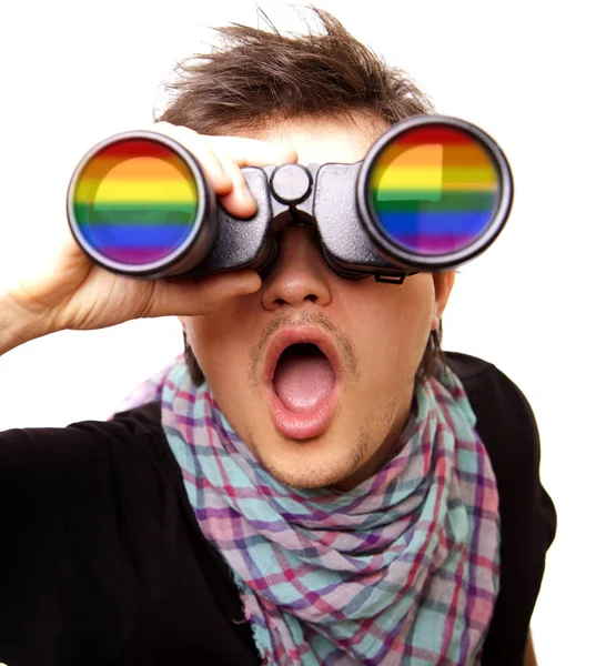Surprised man with binocular and LGBT rainbow — Stock Photo, Image