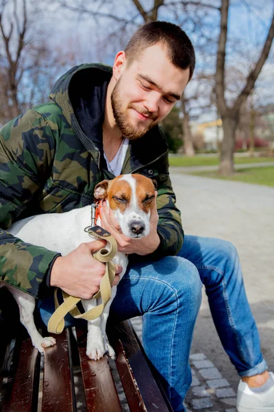 Young man with his dog, Jack Russell Terrier, — Stock Photo, Image