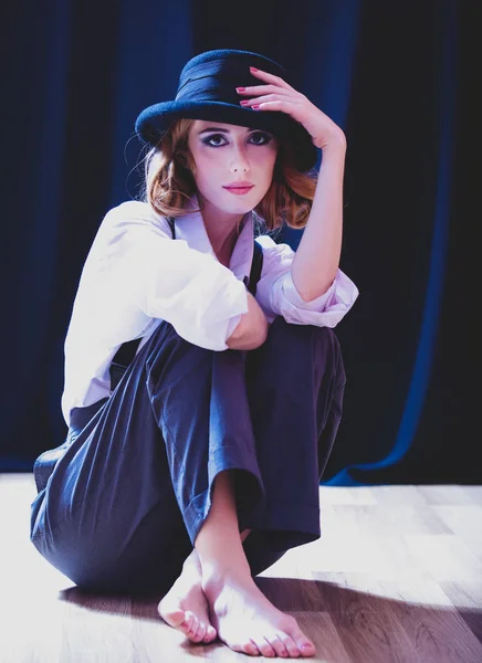 Fashion redhead girl with tie in studio. — Stock Photo, Image