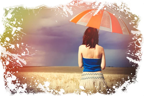 Young woman with umbrella on wheat field in storm time — Stock Photo, Image