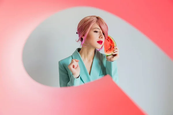 Young girl with pink hair and in blue jacket holding watermelon — Stock Photo, Image