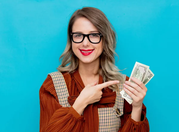 Young woman with money in hand