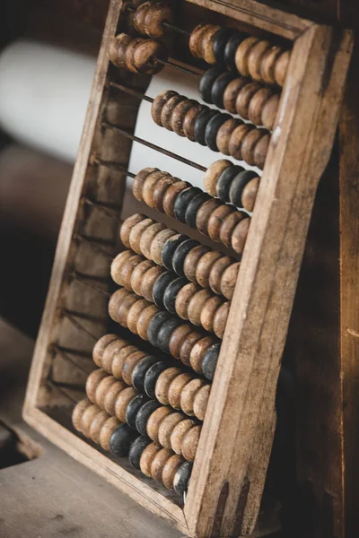 Old worn out wooden abacus on a table — Stock Photo, Image