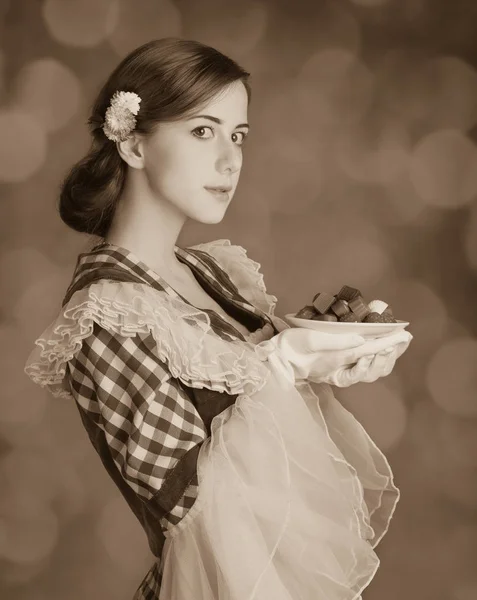 Beautiful redhead women with candy. — Stock Photo, Image