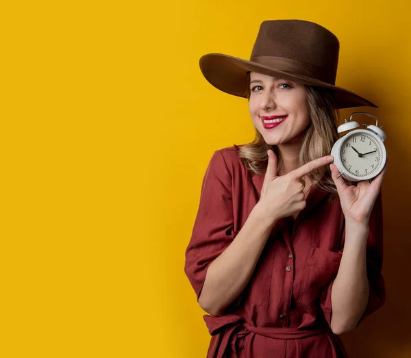 Woman in 1940s style clothes with alarm clock — Stock Photo, Image