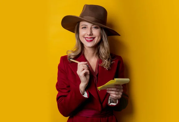 Woman in 1940s style clothes with notebook and pen — Stock Photo, Image