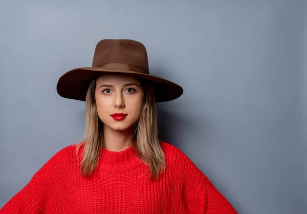 Young woman in red sweater and hat — Stock Photo, Image