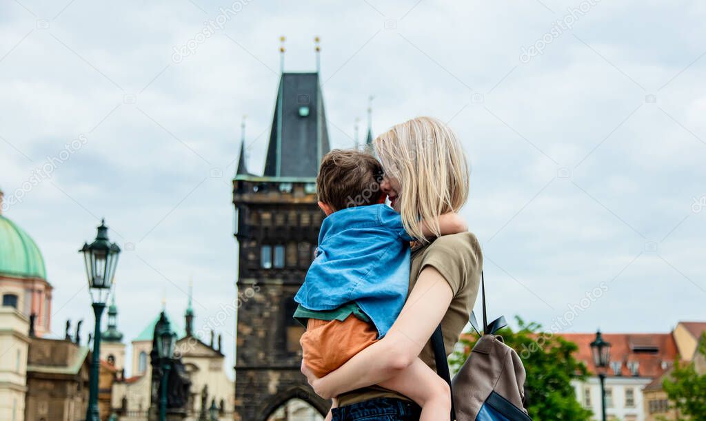 Mother and son at Charles bridge in Prague, Czech Republic