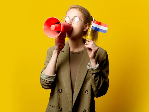 Style Blonde Woman Jacket Dutch Flag Megaphone Yellow Background — Stock Photo, Image