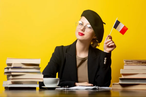 Style Blonde Woman Beret Sitting Table French Flag Books Yellow — Stock Photo, Image
