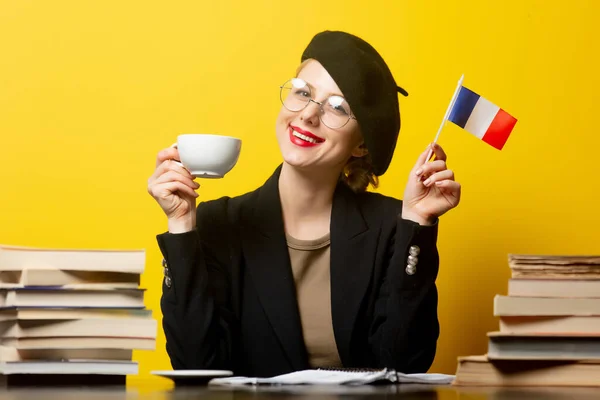 Style Blonde Woman Beret Sitting Table French Flag Books Yellow — Stock Photo, Image