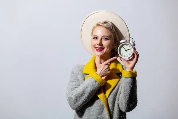 Blonde Girl Grey Coat Vintage Hairdress Alarm Clock White Background — Stock Photo, Image