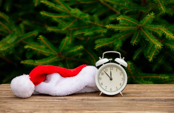 Vintage Alarm Clock Santa Claus Hat Wooden Table Spruce Branches — Stock Photo, Image