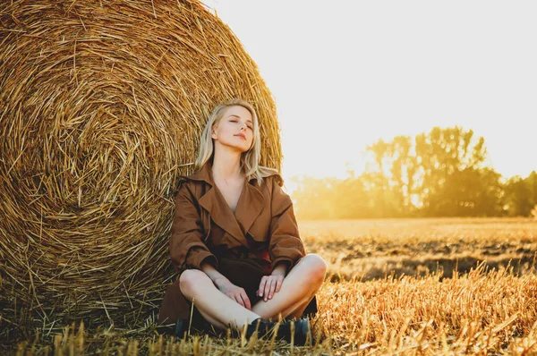 Blonde Girl Sitting Rolled Haystack Field Sunset Time — Stock Photo, Image