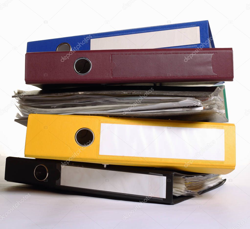 a pile of stationery folders on white