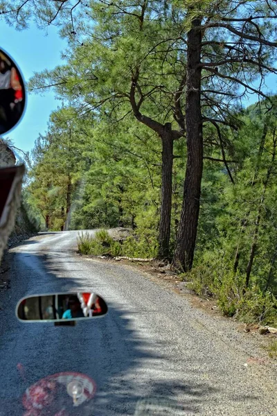 A beautiful empty gravel road in the mountains of Turkey on a warm summer day