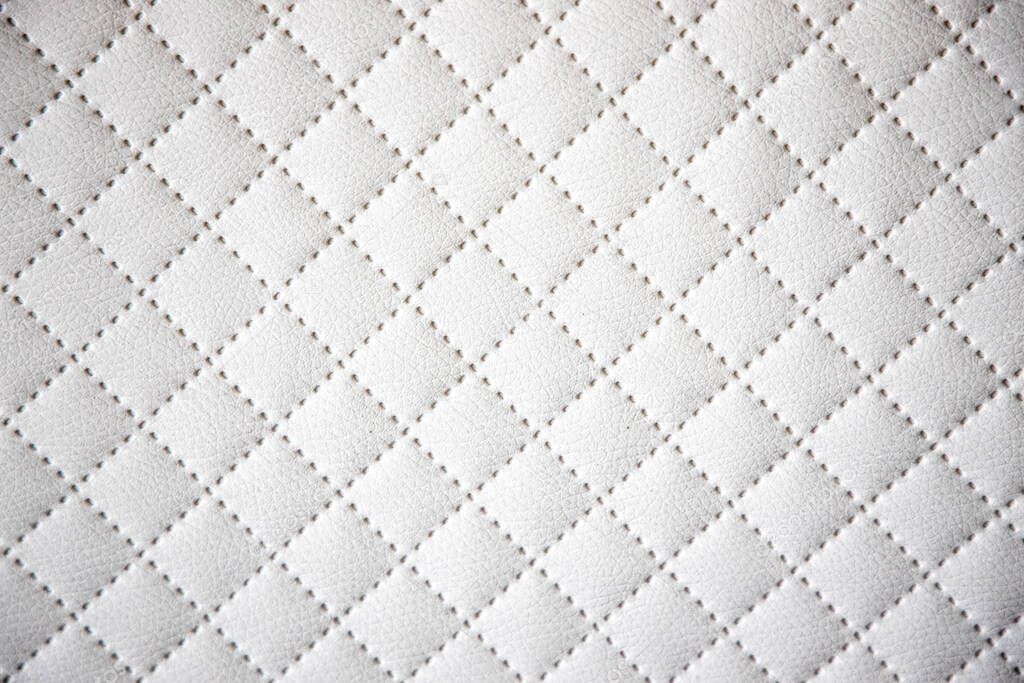 beautiful interesting original white leather background with quilting pattern