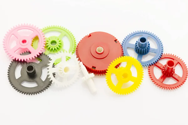 Group Plastic Colorful Clockwork Gear White Reflective Background — Stock Photo, Image