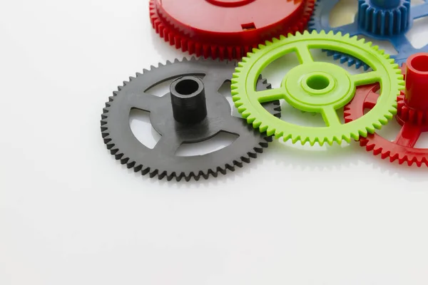 Group Plastic Colorful Clockwork Gear White Reflective Background — Stock Photo, Image