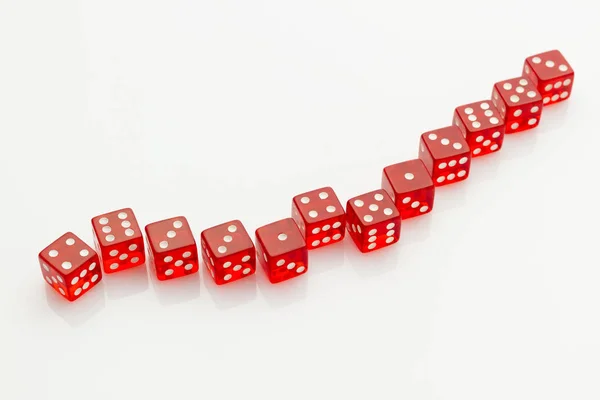 Group Red Transparent Dice Laying Snake Shape White Reflective Background — Stock Photo, Image