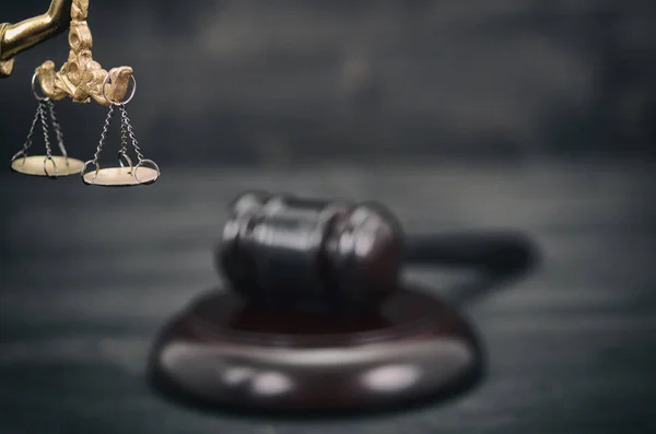 Law and Justice, Legality concept, Judge Gavel, Scales of Justice and Lady Justice on a black wooden background.