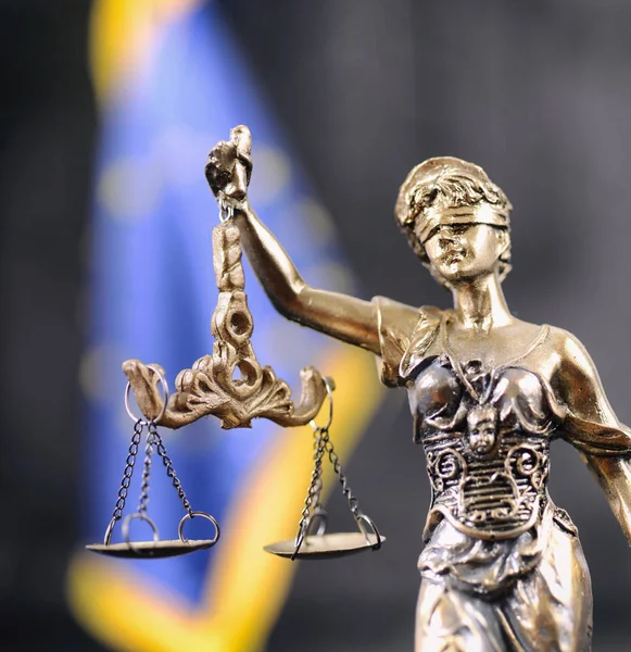 Law and Justice, Legality concept, Scales of Justice, Justitia, Lady Justice in front of the European Union flag in the background.