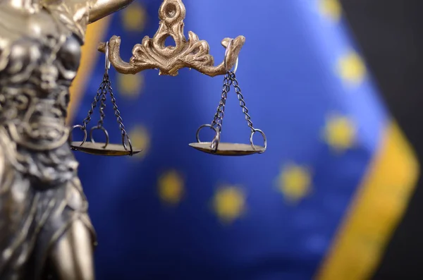Law and Justice, Legality concept, Scales of Justice, Justitia, Lady Justice in front of the European Union flag in the background.