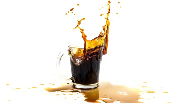 A cup of coffee with splashes in the process of spilling on a white background