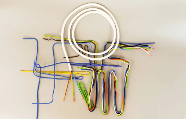 The wires of several types in colored insulation are curved in d