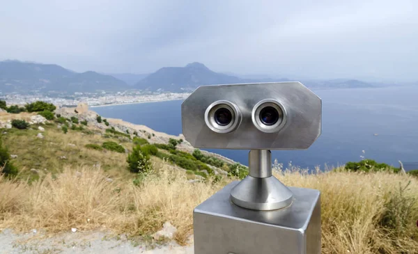 Coin Operated Binocular viewer next to the waterside promenade in Antalya looking out to the Bay and city