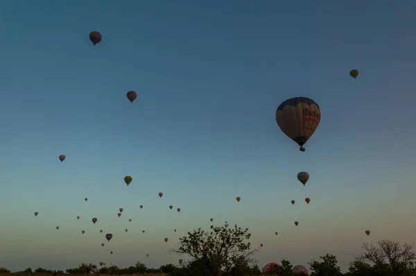 Hot air balloon flying over rock landscape at Cappadocia Turkey — Stock Photo, Image