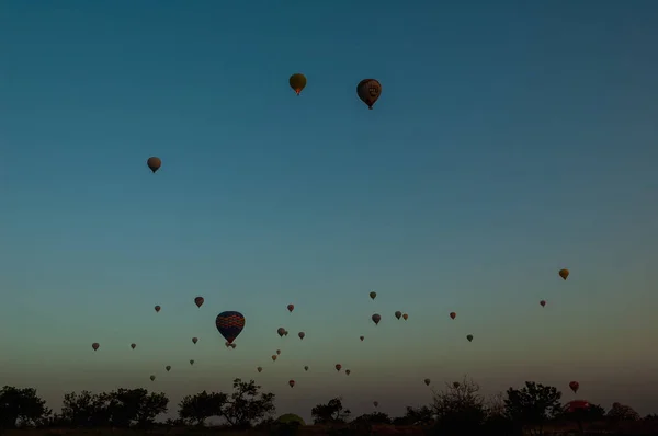 Hot air balloon flying over rock landscape at Cappadocia Turkey — Stock Photo, Image