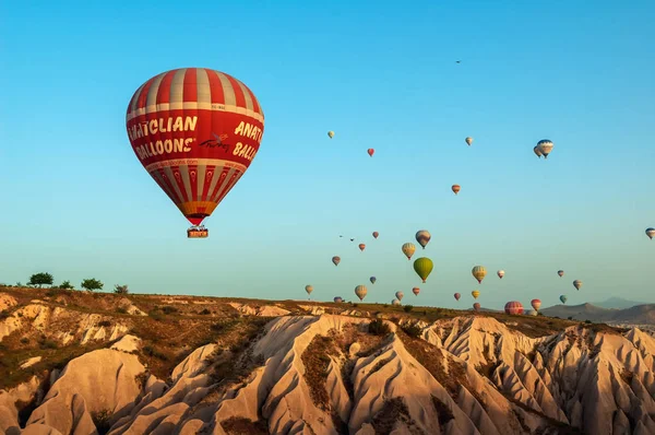 Hot air balloon flying over rock landscape at Cappadocia Turkey — Stock Photo, Image