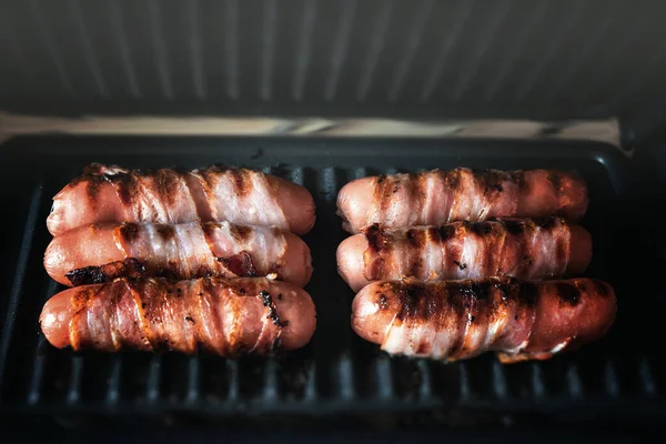 Appetizing Sausages Wrapped Bacon Grilled Electric Grill — Stock Photo, Image