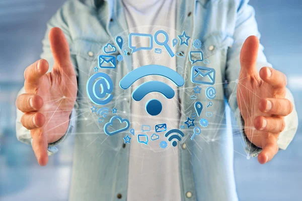 man holding icon with wifi symbol connection surrounded by multimedia and internet application logo - 3d rendering