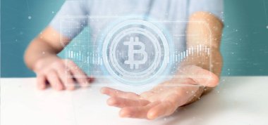 Bir teknoloji Bitcoin simgesi üzerinde bir daire 3d render tutan bir adam görünümü