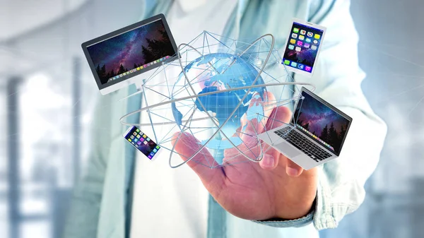 一个商人持有的计算机和设备显示在未来的界面与国际网络 — 图库照片
